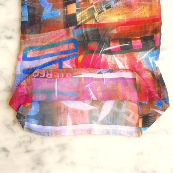 NWOT. Carolina Multi Color Pattern and Words Sheer Wide Leg Pant. - Picture 6 of 6